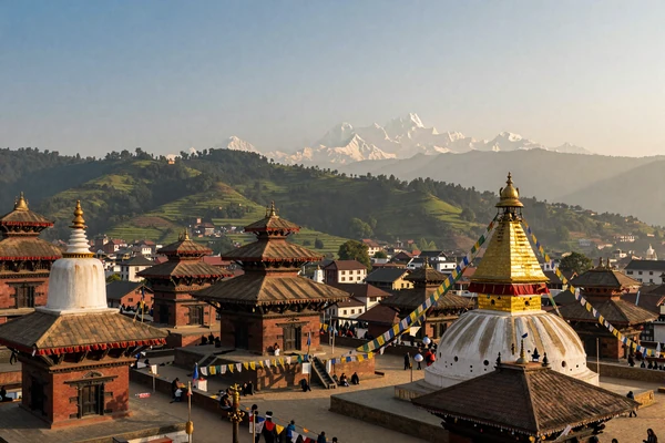 Kathmandu Valley temples with Himalayan mountains and prayer flags at golden hour in Nepal
